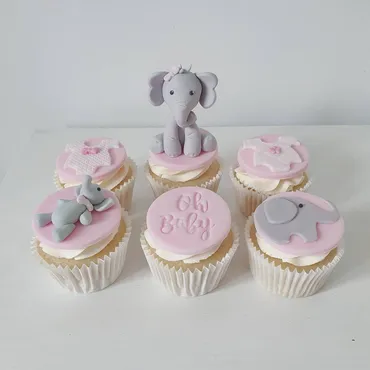 Pink and blue birthday cupcakes with Happy Birthday Eva disc and floral swirl buttercream for 13th birthday